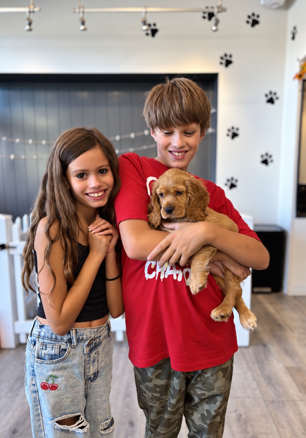 Otto and Opal holding their puppy