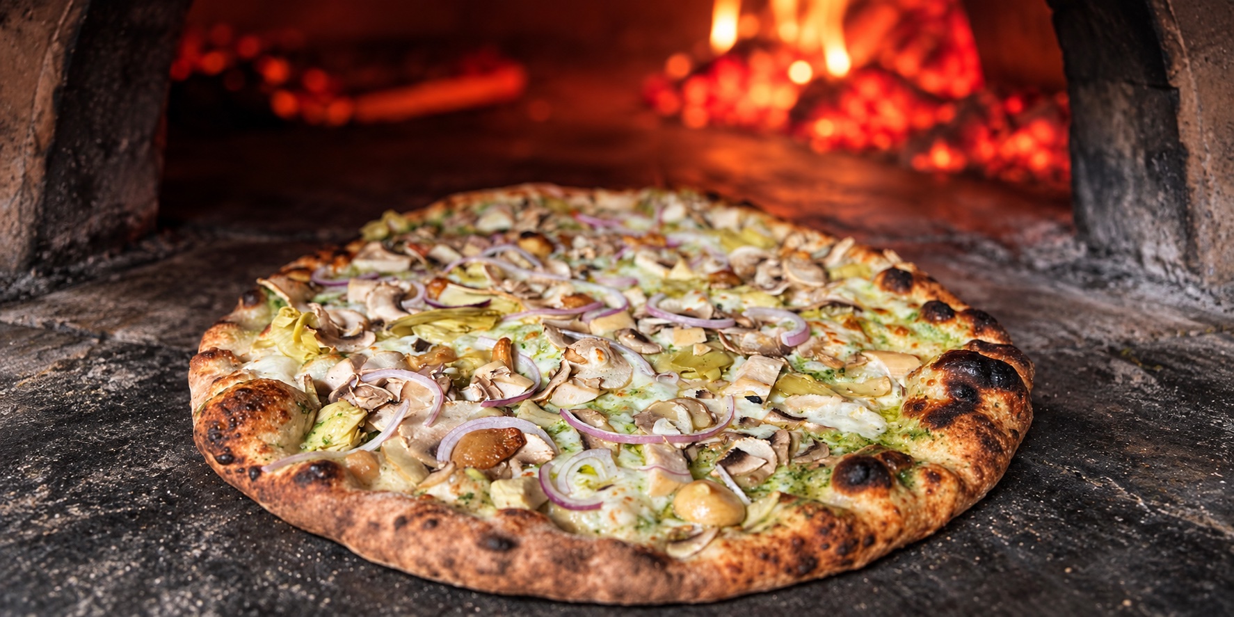 Wood-fired pizza at Roots